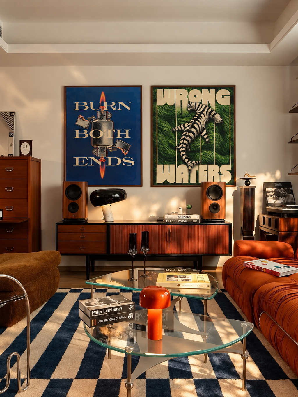 Burn Both Ends and Wrong Waters prints above a mid-century credenza
