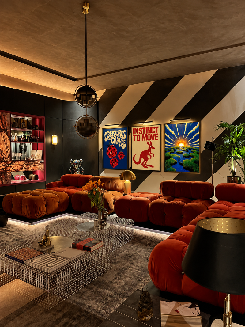Creatures of Chance, Instinct to Move and Origin Point prints in a moody lounge